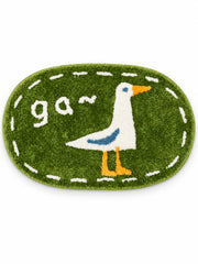 Goose Talk green oval mat, 40 x 60 cm, on a white background.