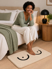 Minimal Curves Line-Art Bath Mat beside a bed
