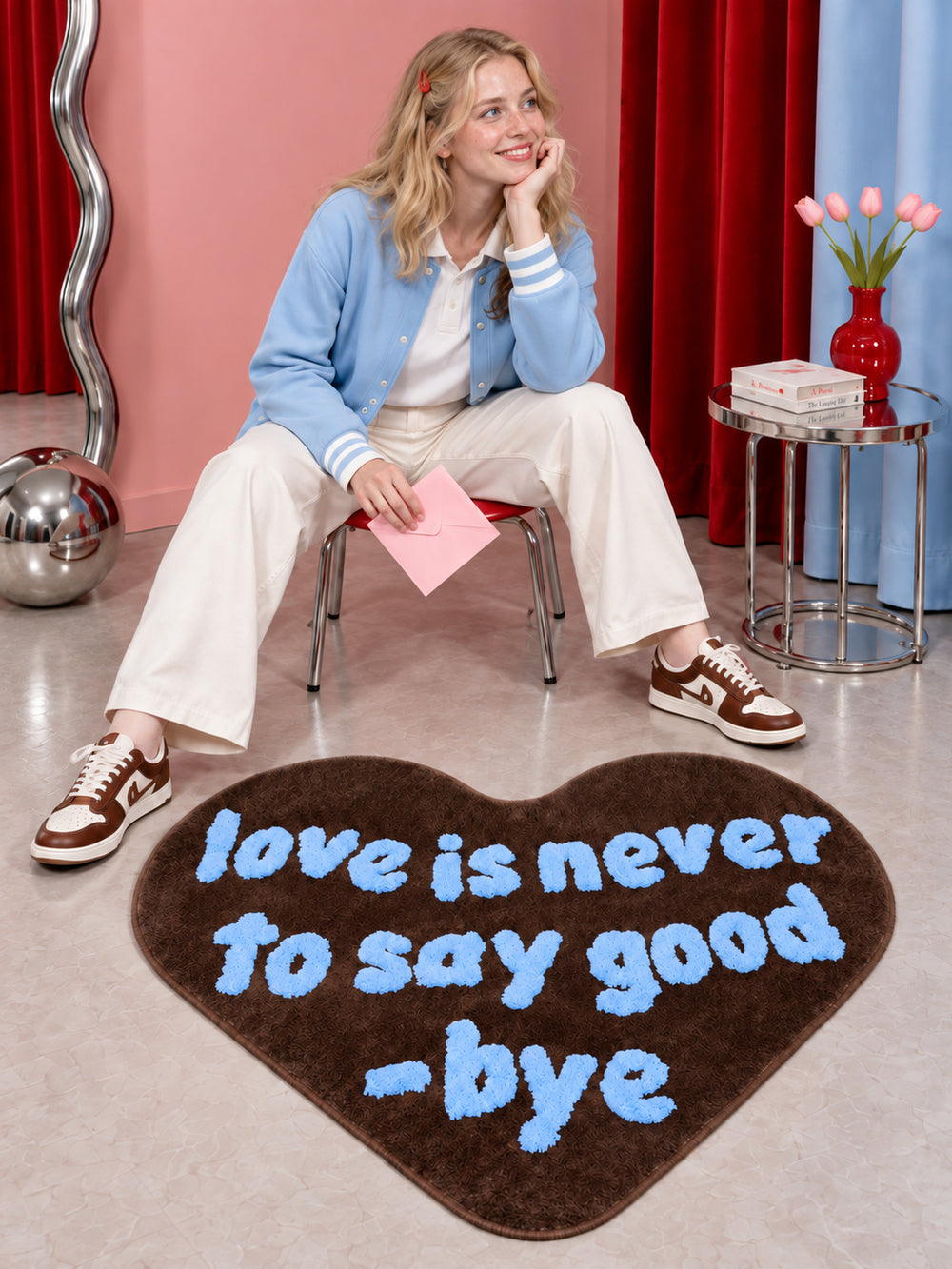 Brown heart-shaped accent rug on the floor beside a seated person