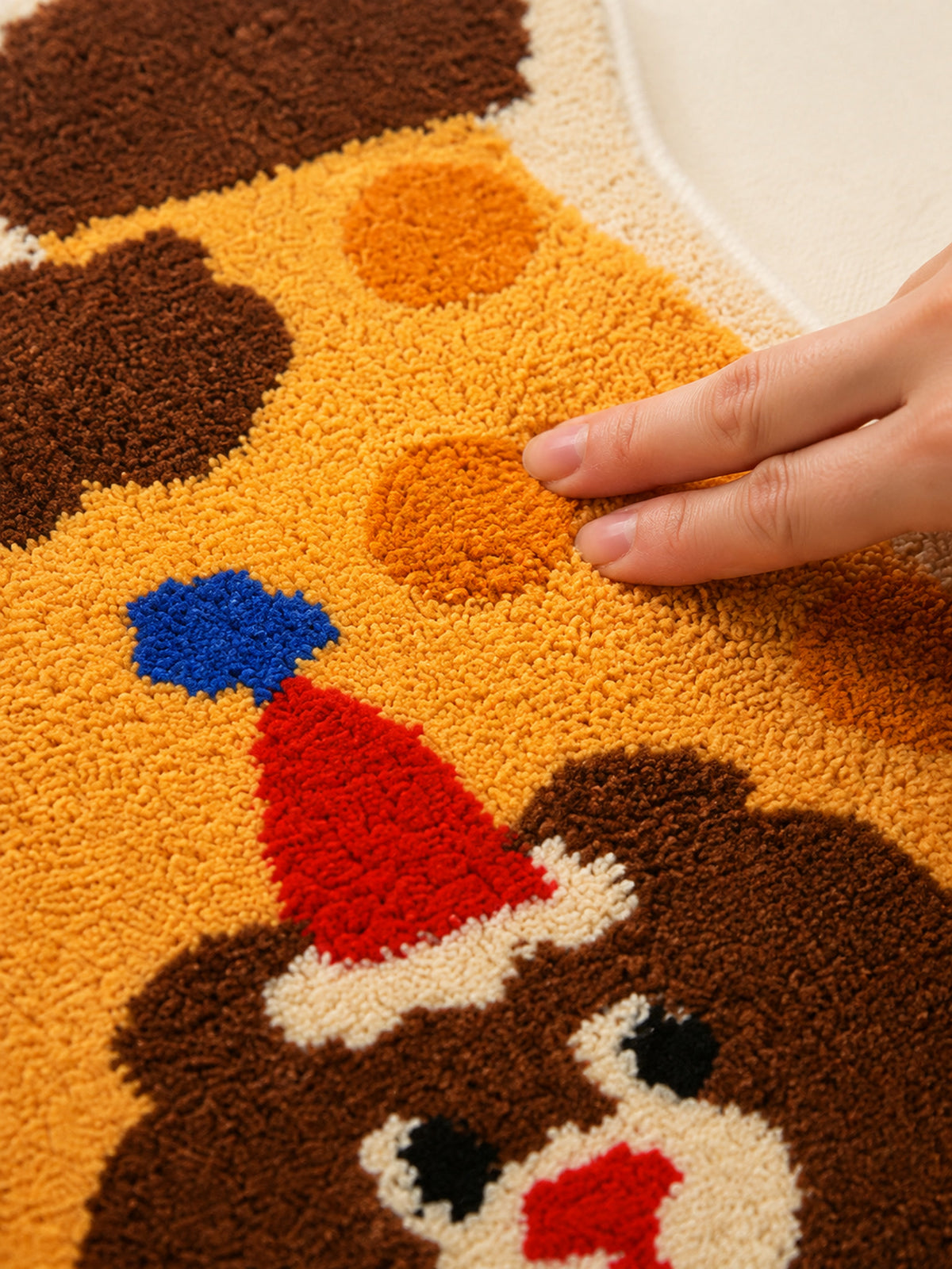 Close-up of the soft microfiber surface of Party Bear Polka-Dot Bath Mat