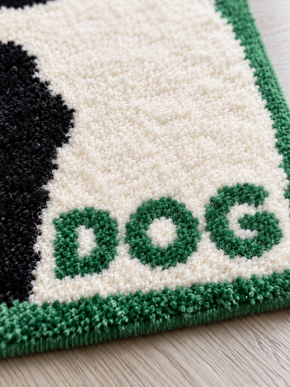 Close-up of the soft microfiber surface of Black & White Puppy Shaped Bath Mat