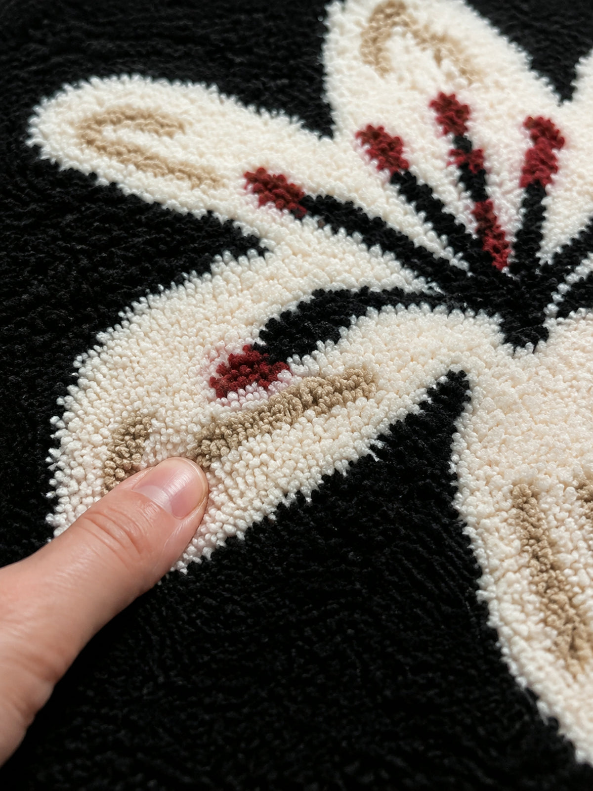 Close-up of the soft microfiber surface of Midnight Lily Oval Bath Mat