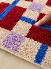 Close-up of the soft microfiber surface of Crimson Grid Colorblock Bath Mat
