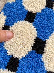 Close-up of the soft microfiber surface of Coastal Blue Basketweave Pattern Bath Mat