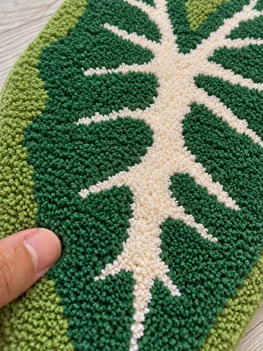 Close-up of the soft microfiber surface of Alocasia Leaf Tropical Green Bath Mat