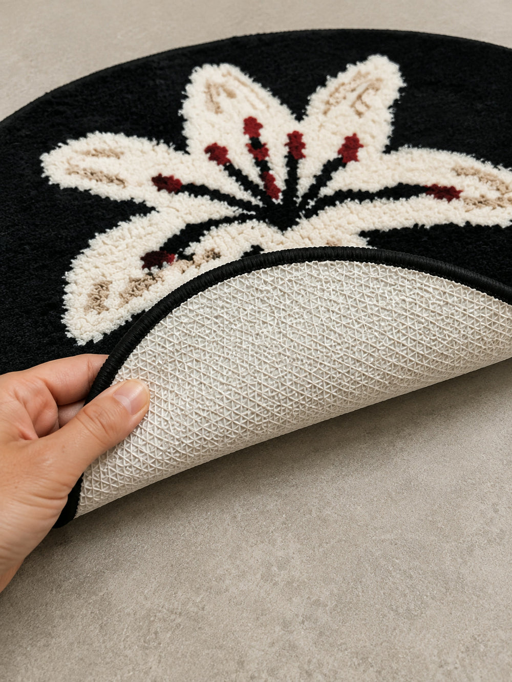 Close-up of the TPE backing of Midnight Lily Oval Bath Mat