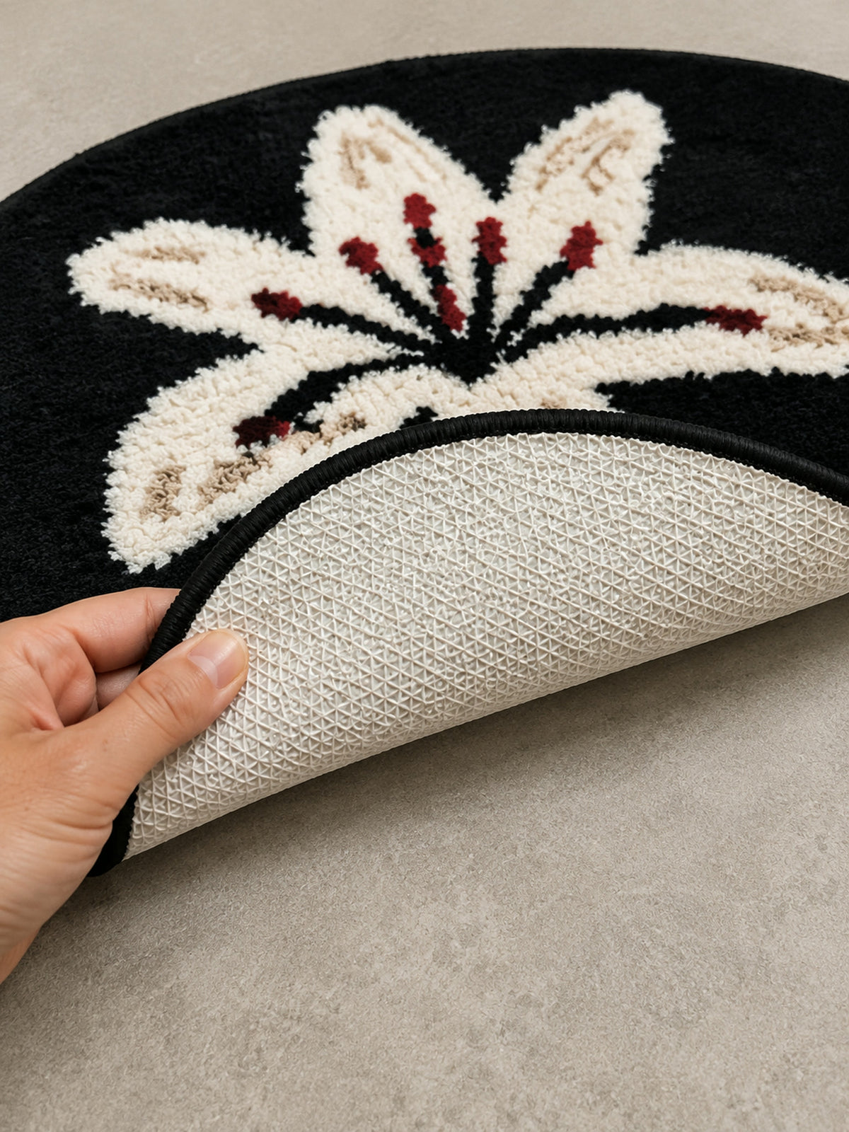 Close-up of the TPE backing of Midnight Lily Oval Bath Mat