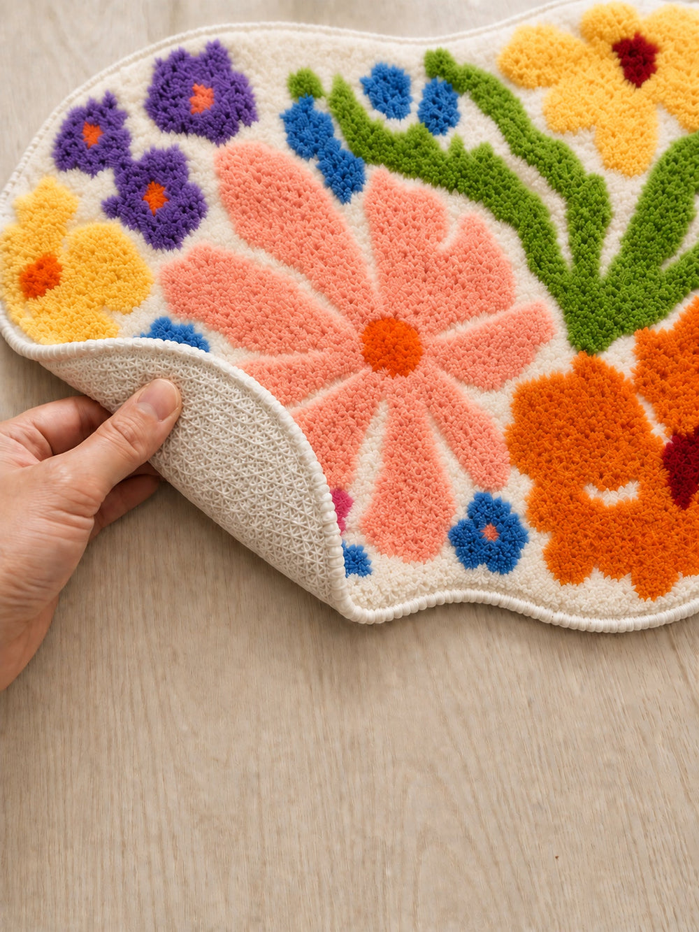 Close-up of the TPE backing of Spring Meadow Colorful Floral Bath Mat