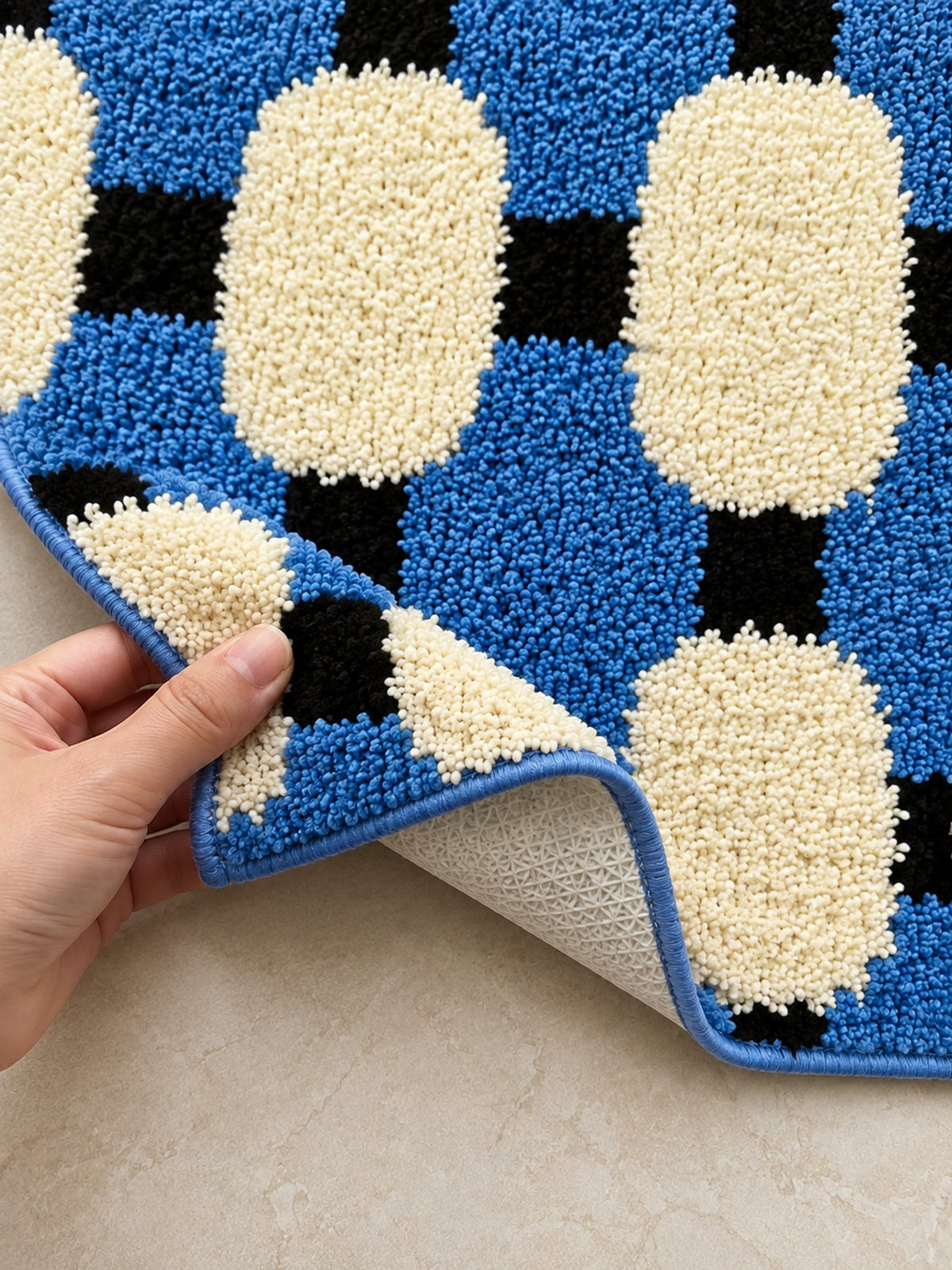 Close-up of the TPE backing of Coastal Blue Basketweave Pattern Bath Mat