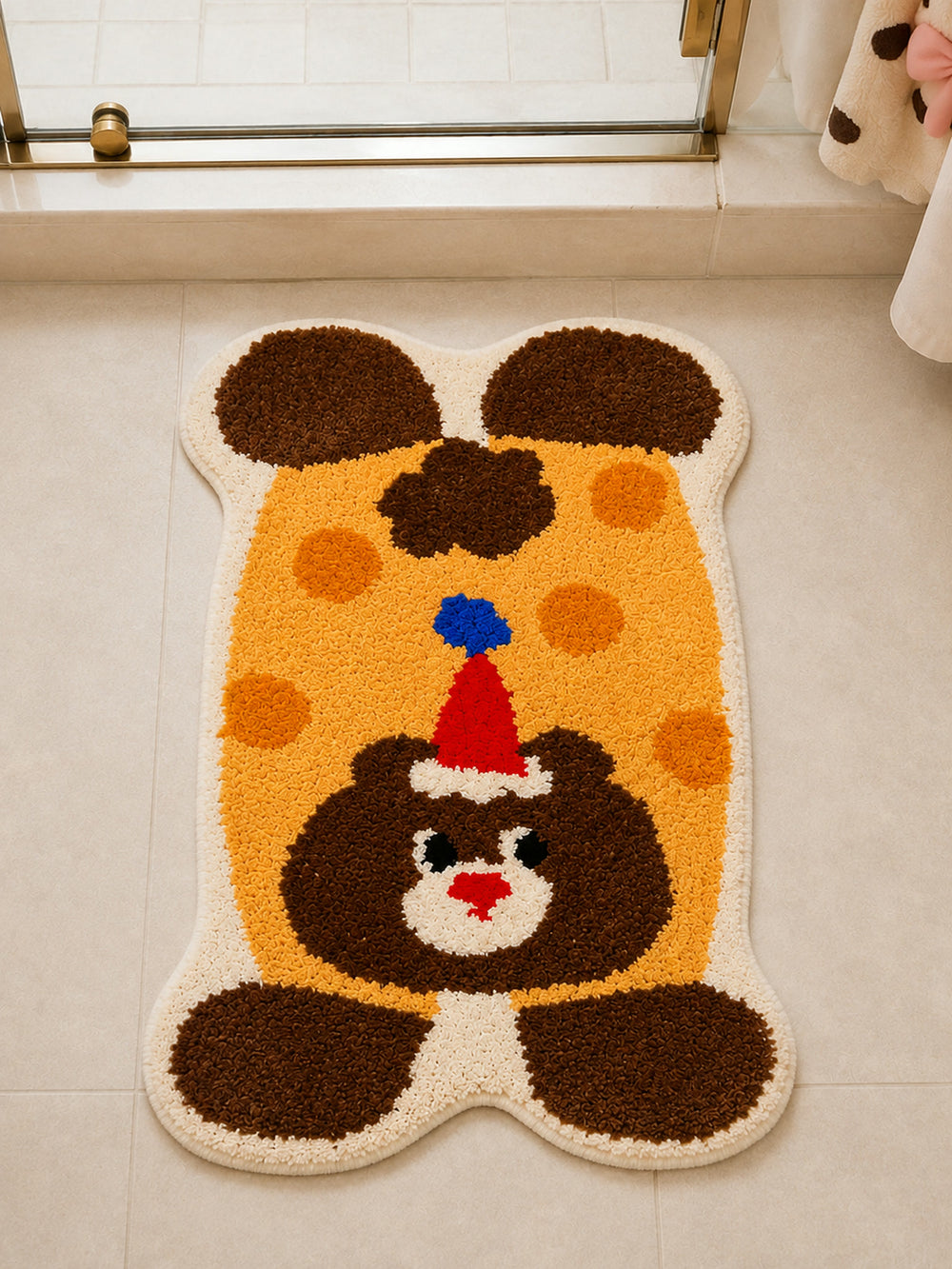 Party Bear Polka-Dot Bath Mat on a bathroom floor, shown from another angle