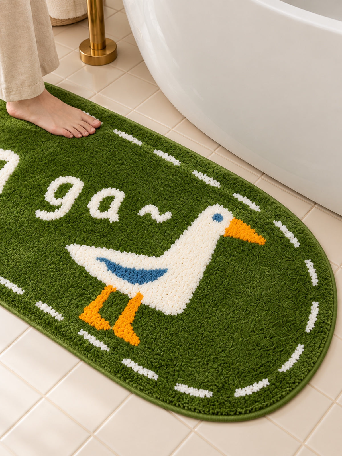 Goose Talk Green Oval Bath Mat & Runner Rug on a bathroom floor, shown from another angle