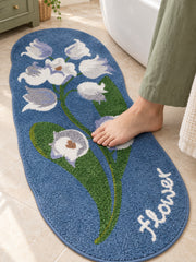 Midnight Garden Blue Floral Bath Mat on a bathroom floor, shown from another angle