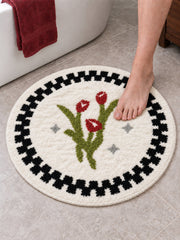 Heritage Tulip Round Bath Mat on a bathroom floor, shown from another angle