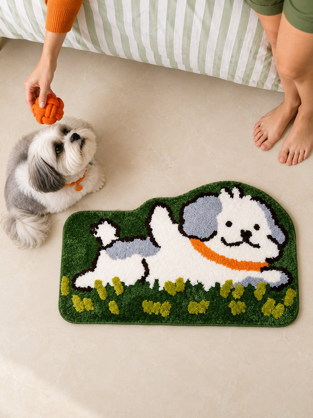 Clover Meadow Pup Shaped Bath Mat beside a bed, shown from another angle