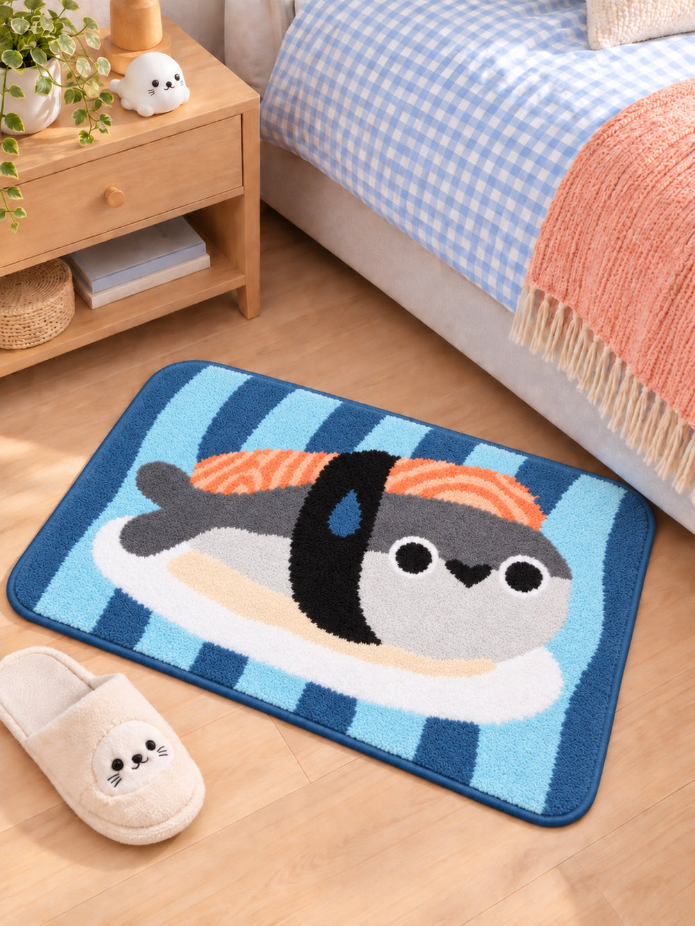 Sushi Fish Blue Stripe Bath Mat beside a bed, shown from another angle