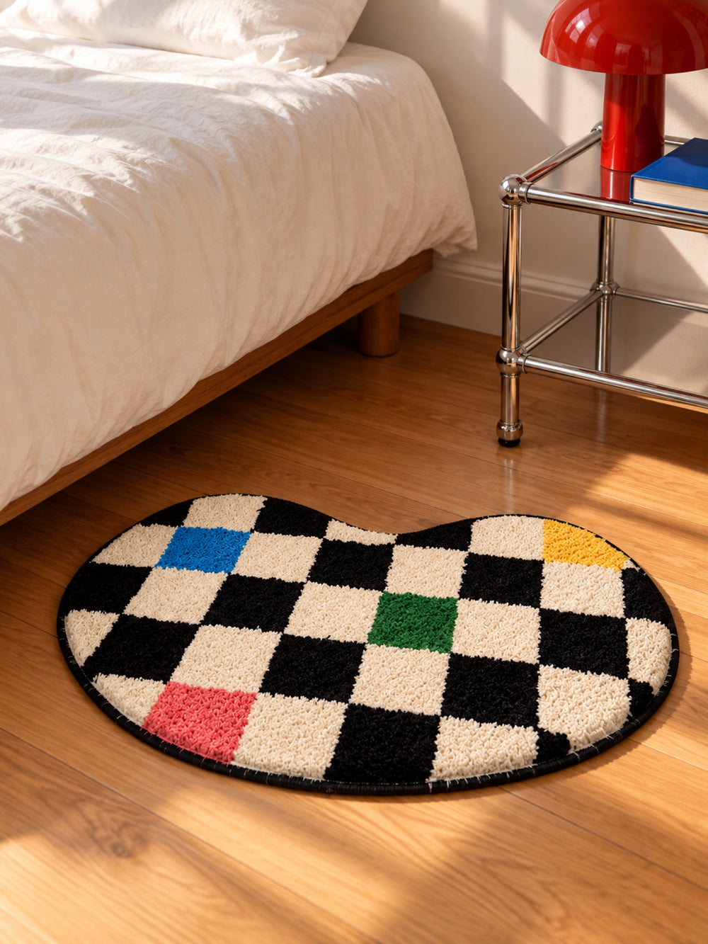 Color Pop Wavy Checkerboard Bath Mat beside a bed, shown from another angle