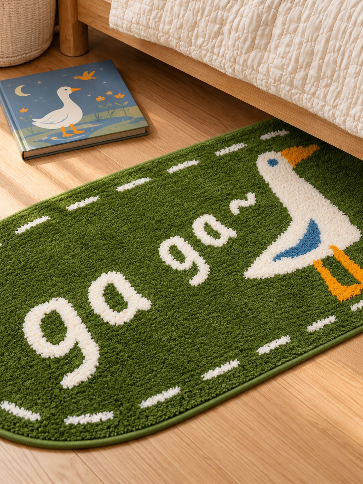 Goose Talk Green Oval Bath Mat & Runner Rug beside a bed, shown from another angle