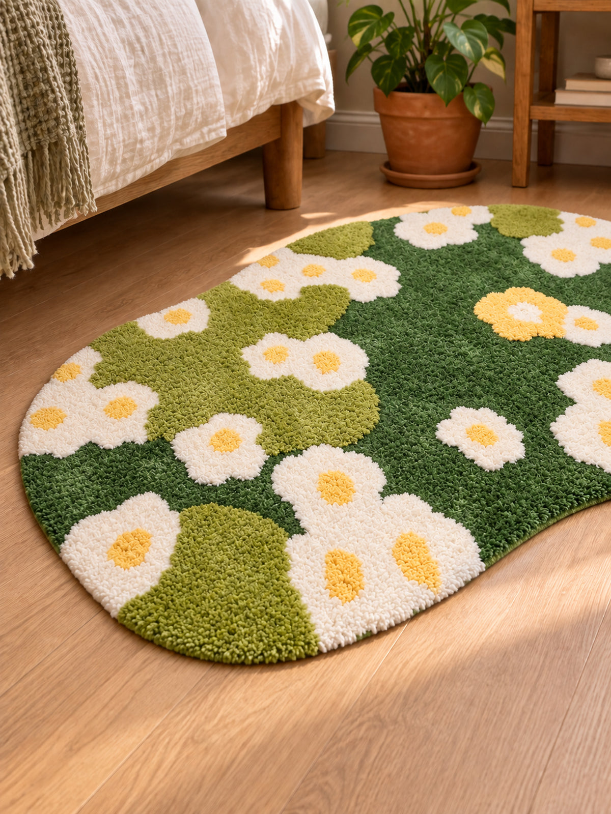 Daisy Meadow Floral Bath Mat & Runner Rug - Green beside a bed, shown from another angle