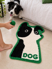 Black & White Puppy Shaped Bath Mat beside a bed, shown from another angle
