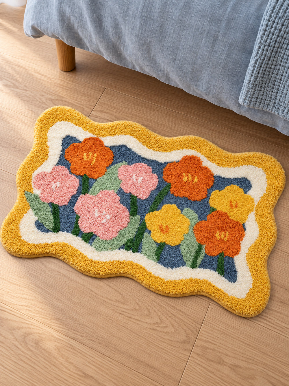 Garden Bloom Wavy Border Bath Mat — bedside context detail