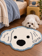 Snowy Puppy Face Shaped Bath Mat — bedside context detail