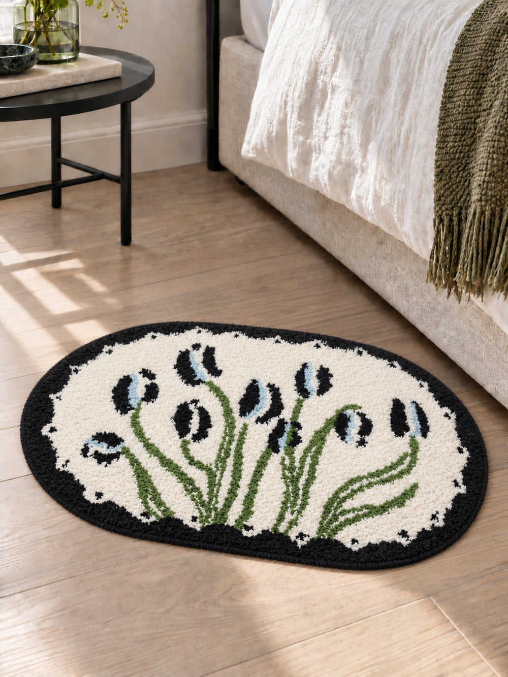 Floral Study Oval Bath Mat - Midnight — bedside context detail