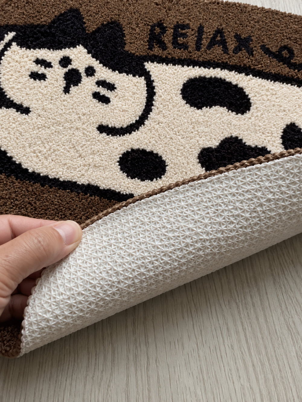 Relaxed Spotted Cat Bath Mat — backing detail
