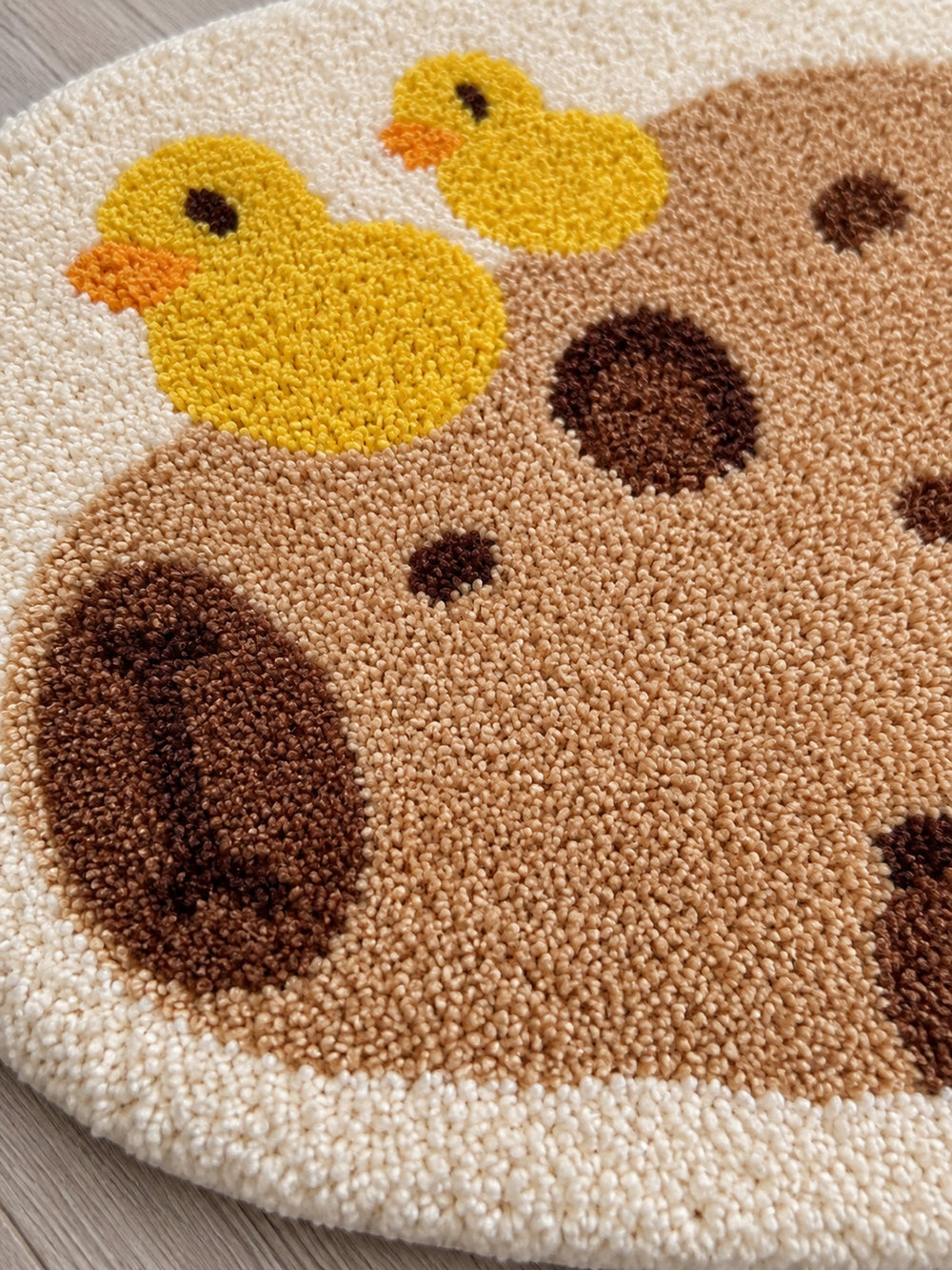 Resting Capybara & Ducklings Shaped Bath Mat — surface detail