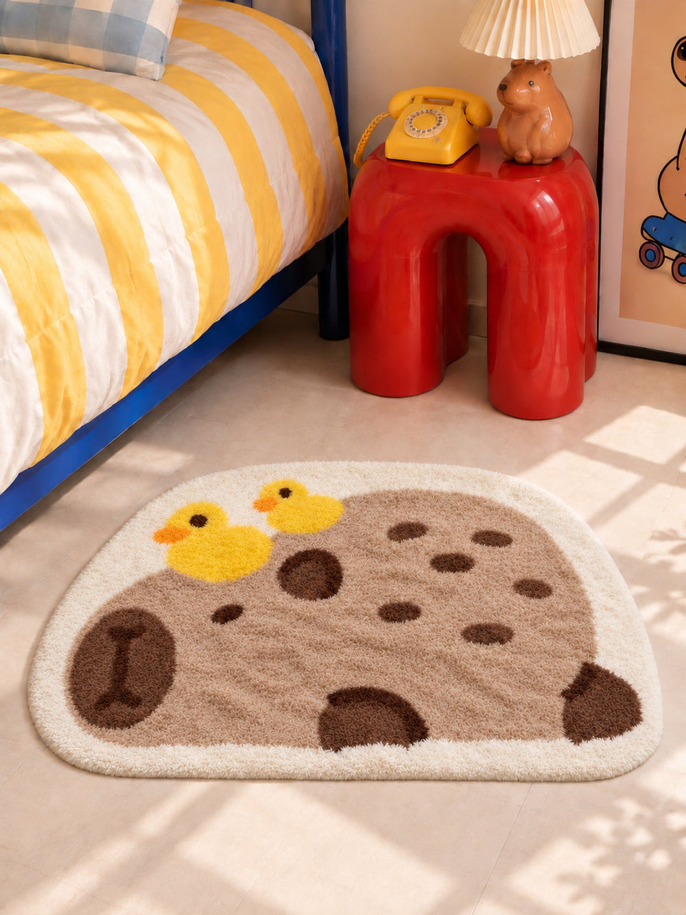 Resting Capybara & Ducklings Shaped Bath Mat — bedside closeup
