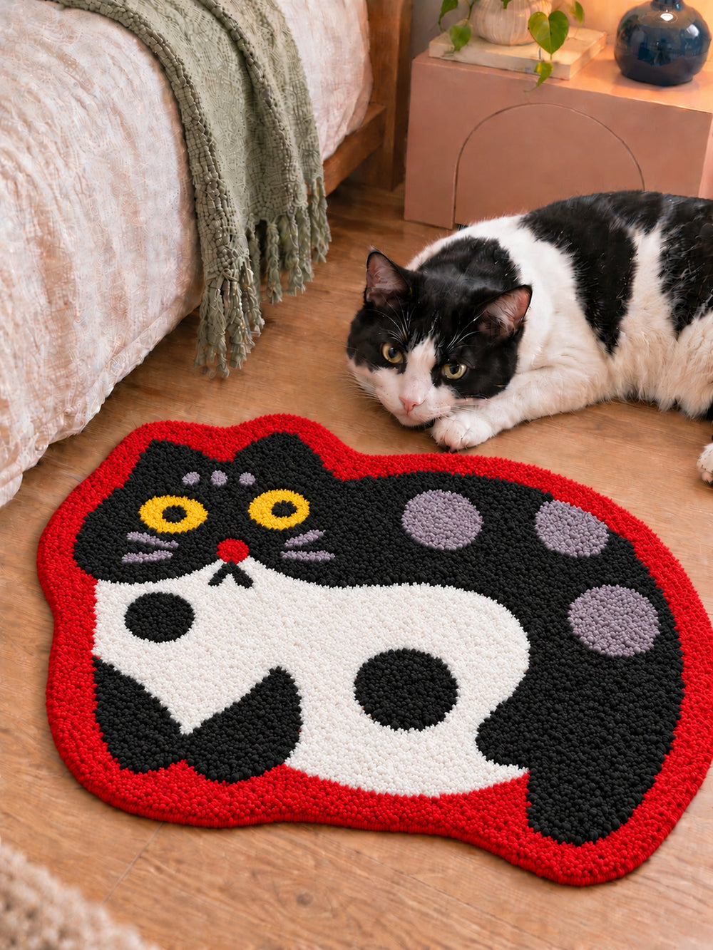 Spotted Cat Red-Outline Bath Mat — bedside context detail