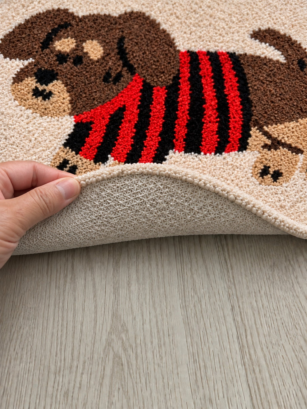 Striped Sweater Dachshund Oval Bath Mat — backing detail