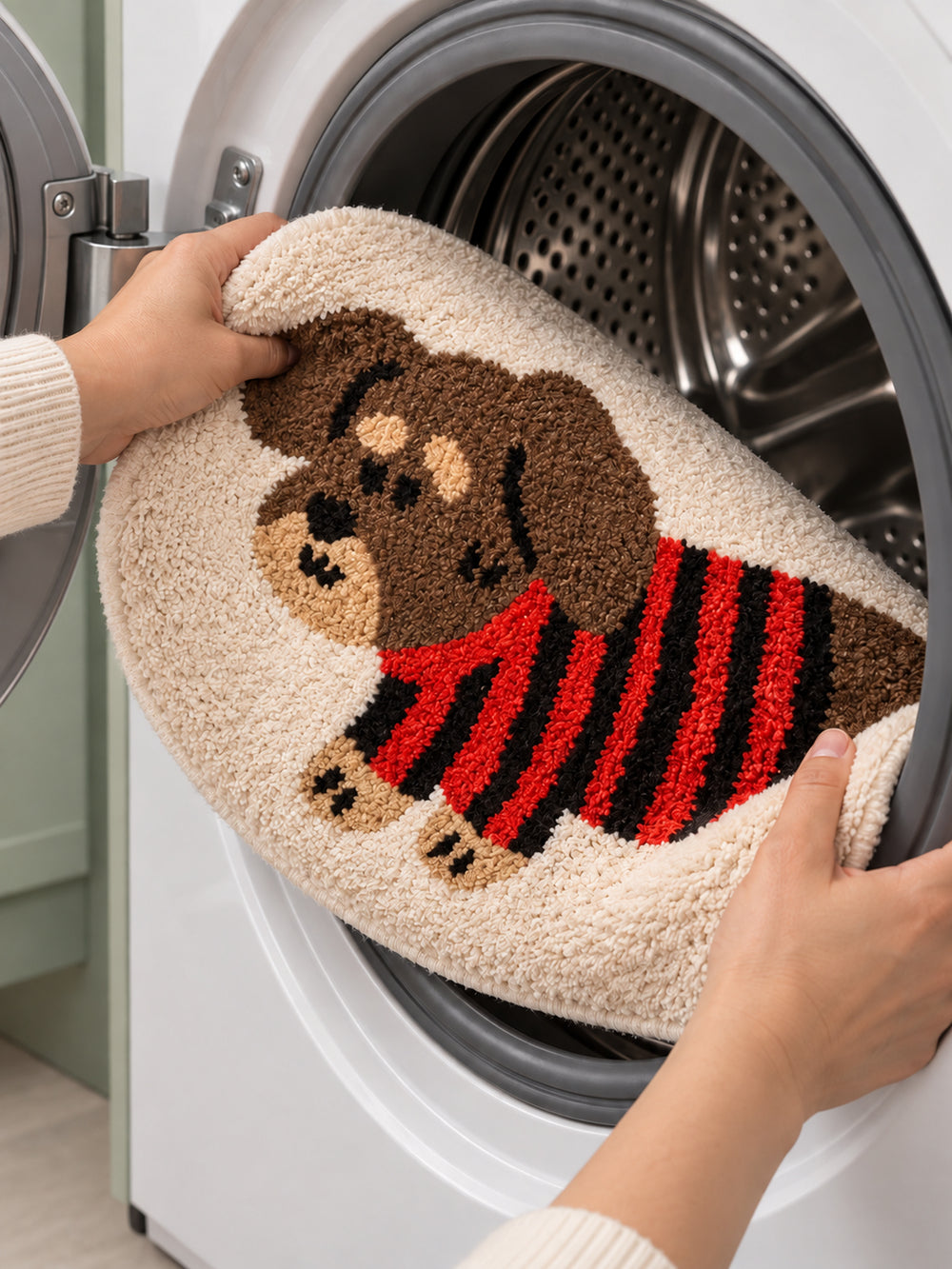Striped Sweater Dachshund Oval Bath Mat — machine-wash care scene