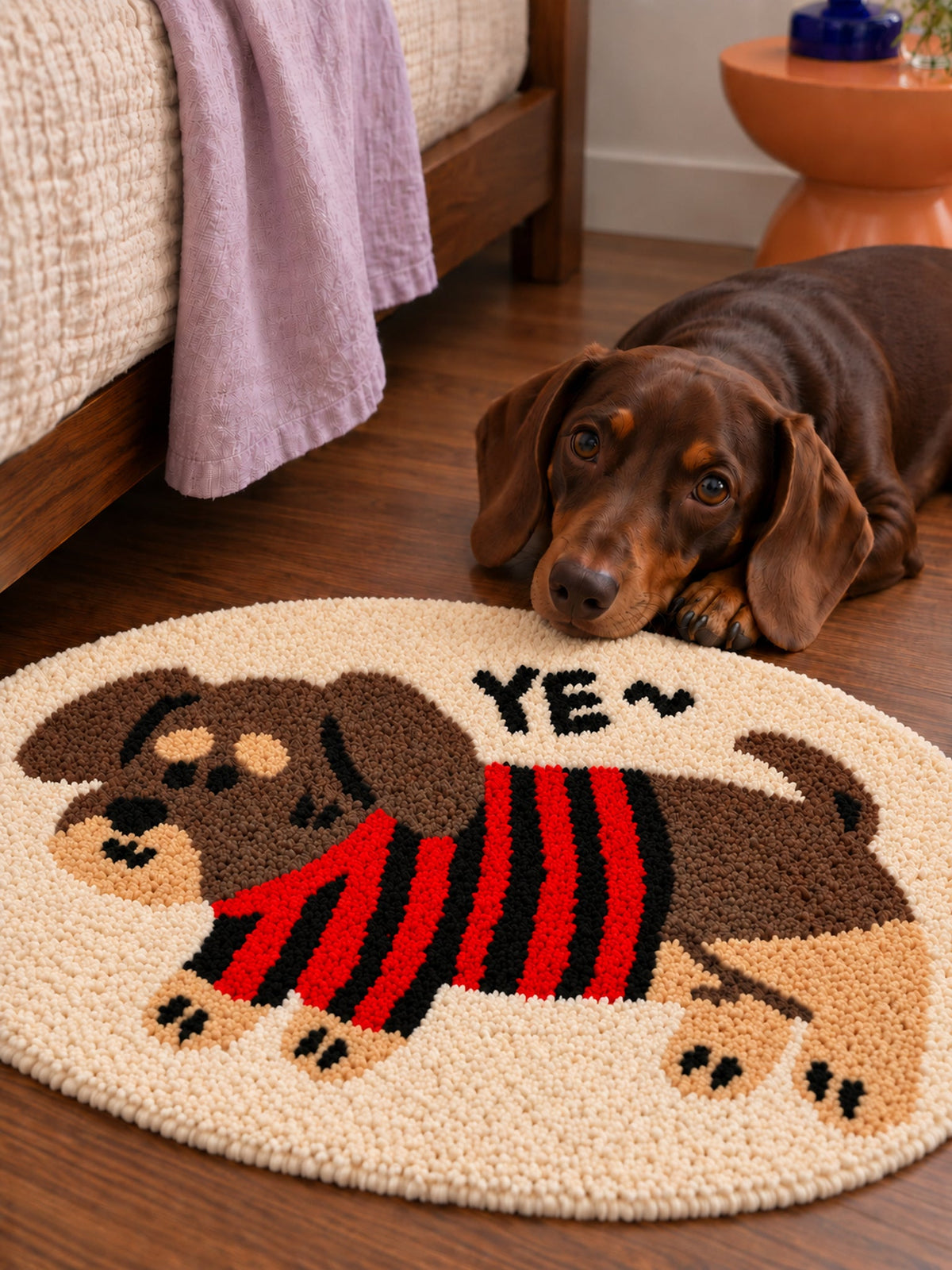 Striped Sweater Dachshund Oval Bath Mat — bedside detail