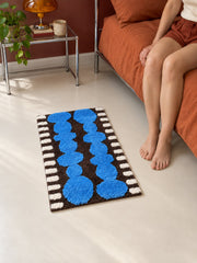 Electric Blue Pebbles Retro Bath Mat — bedroom scene