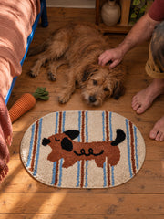Curly Pup Blue Stripe Bath Mat — bedside context detail