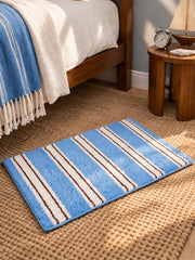 Coastal Pinstripes Blue & Cream Bath Mat — bedside context detail