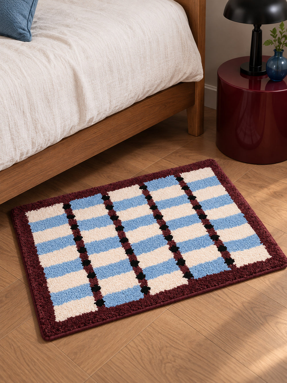 Sage Cocoa Grid Geometric Bath Mat — bedside context detail