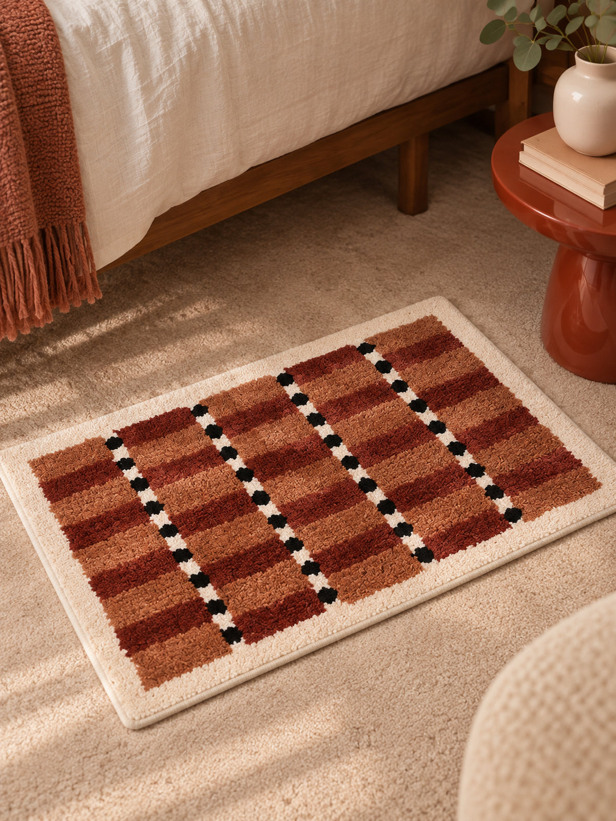 Sage Cocoa Grid Geometric Bath Mat — bedside context detail