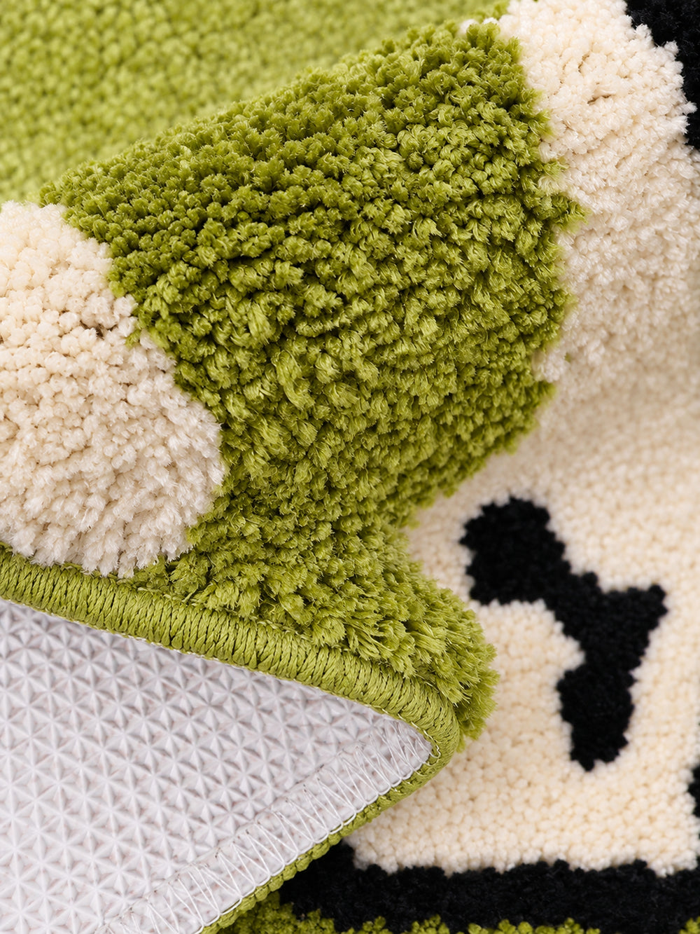 Stretching Spotted Puppy Bath Mat - Green — backing detail