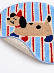 Blue and red striped playful pup mat, 50 x 80 cm, with an edge lifted to show the pale patterned backing.