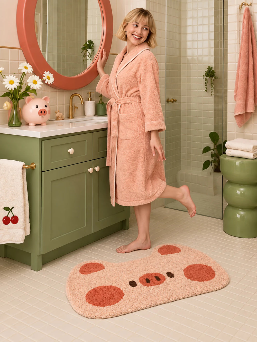 Blushing Piglet Face Bath Mat beside a green bathroom vanity