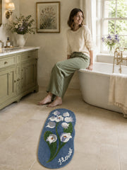Midnight Garden Blue Floral Bath Mat on a bathroom floor