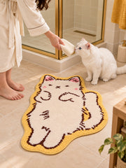 Long Cat Shaped Bath Mat - Ivory on a bathroom floor
