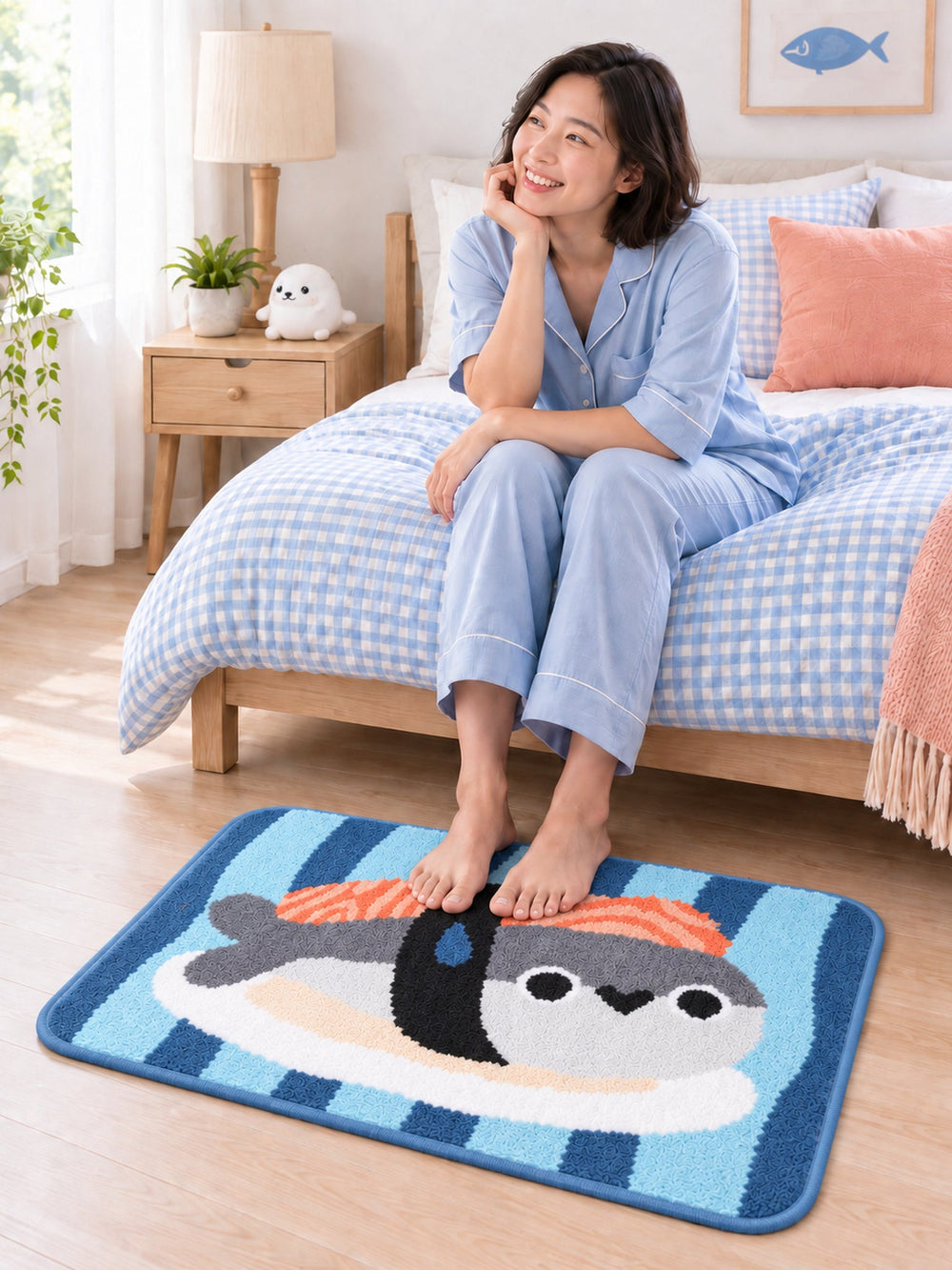 Sushi Fish Blue Stripe Bath Mat beside a bed