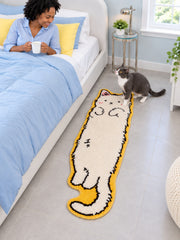 Long Cat Shaped Runner Rug - Ivory beside a bed