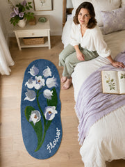 Midnight Garden Blue Floral Bath Mat beside a bed