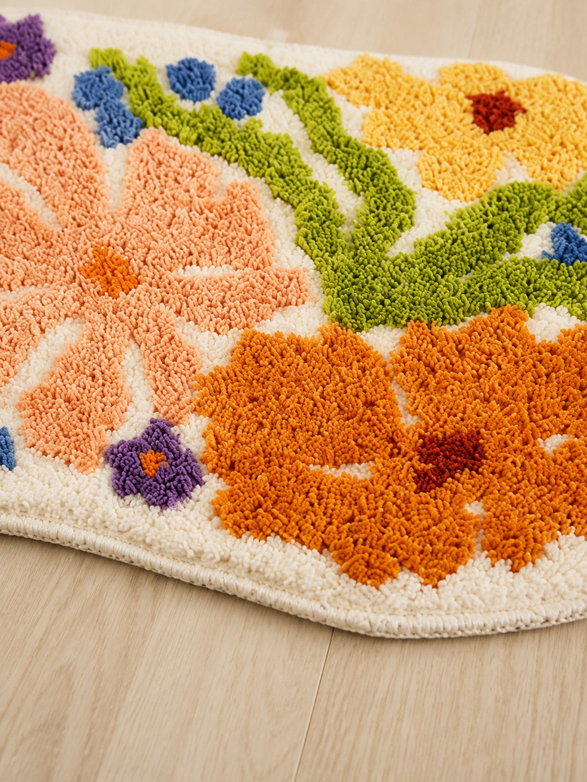 Close-up of the soft microfiber surface of Spring Meadow Colorful Floral Bath Mat