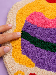 Close-up of the soft microfiber surface of Best Wishes Cake Shaped Bath Mat