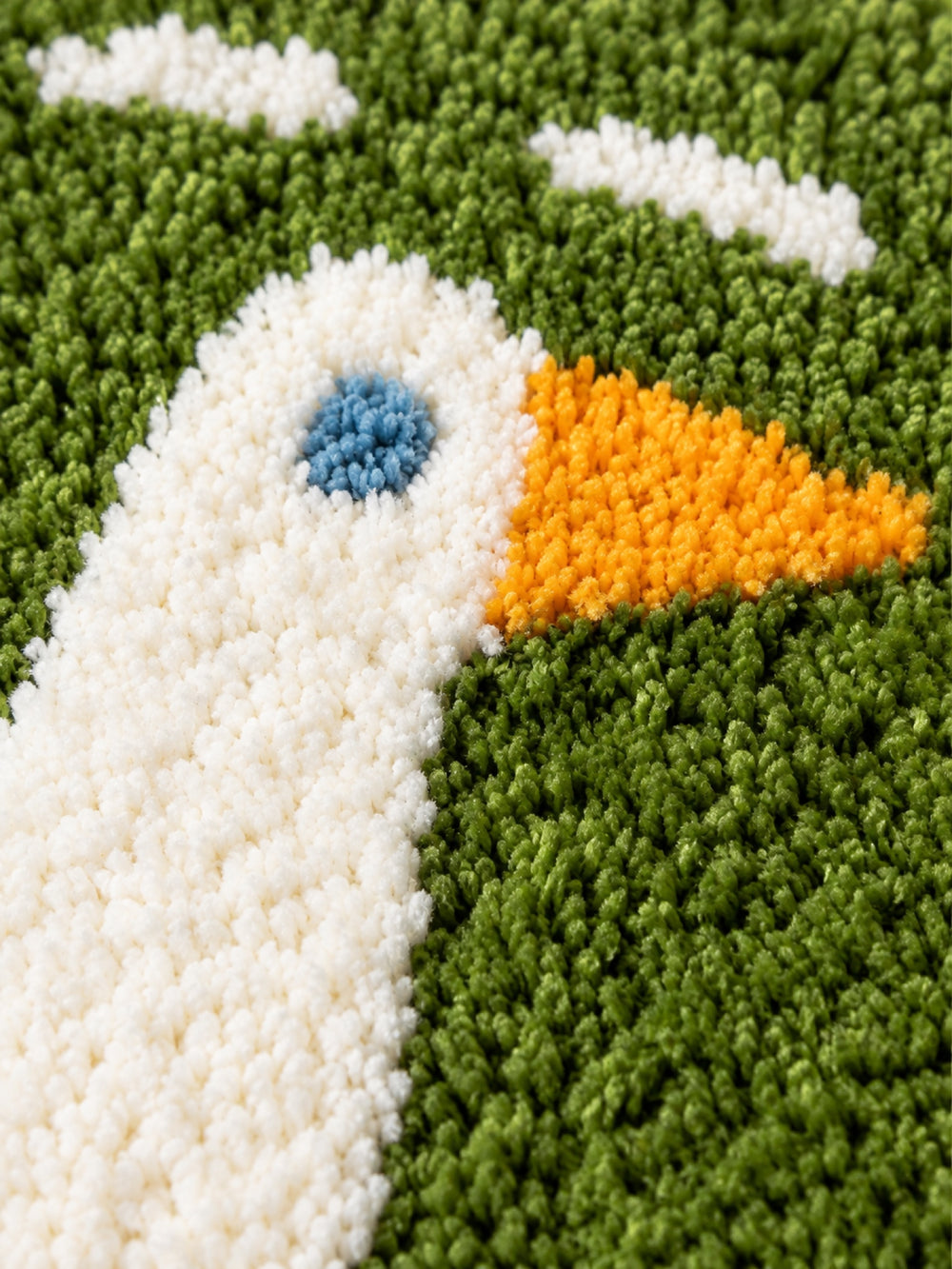Close-up of the soft microfiber surface of Goose Talk Green Oval Bath Mat & Runner Rug