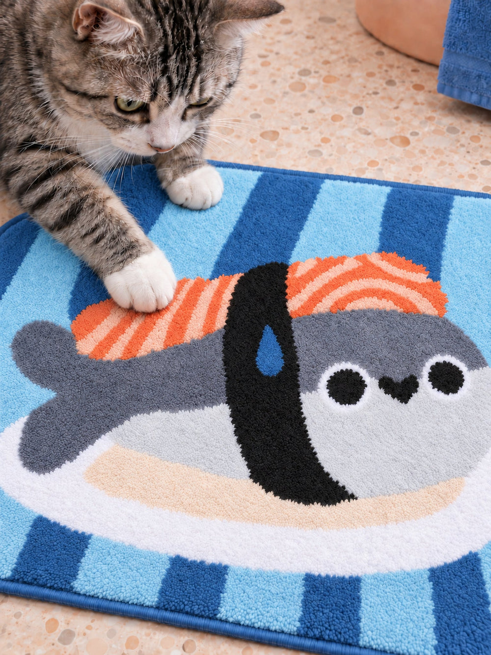 Close-up of the soft microfiber surface of Sushi Fish Blue Stripe Bath Mat